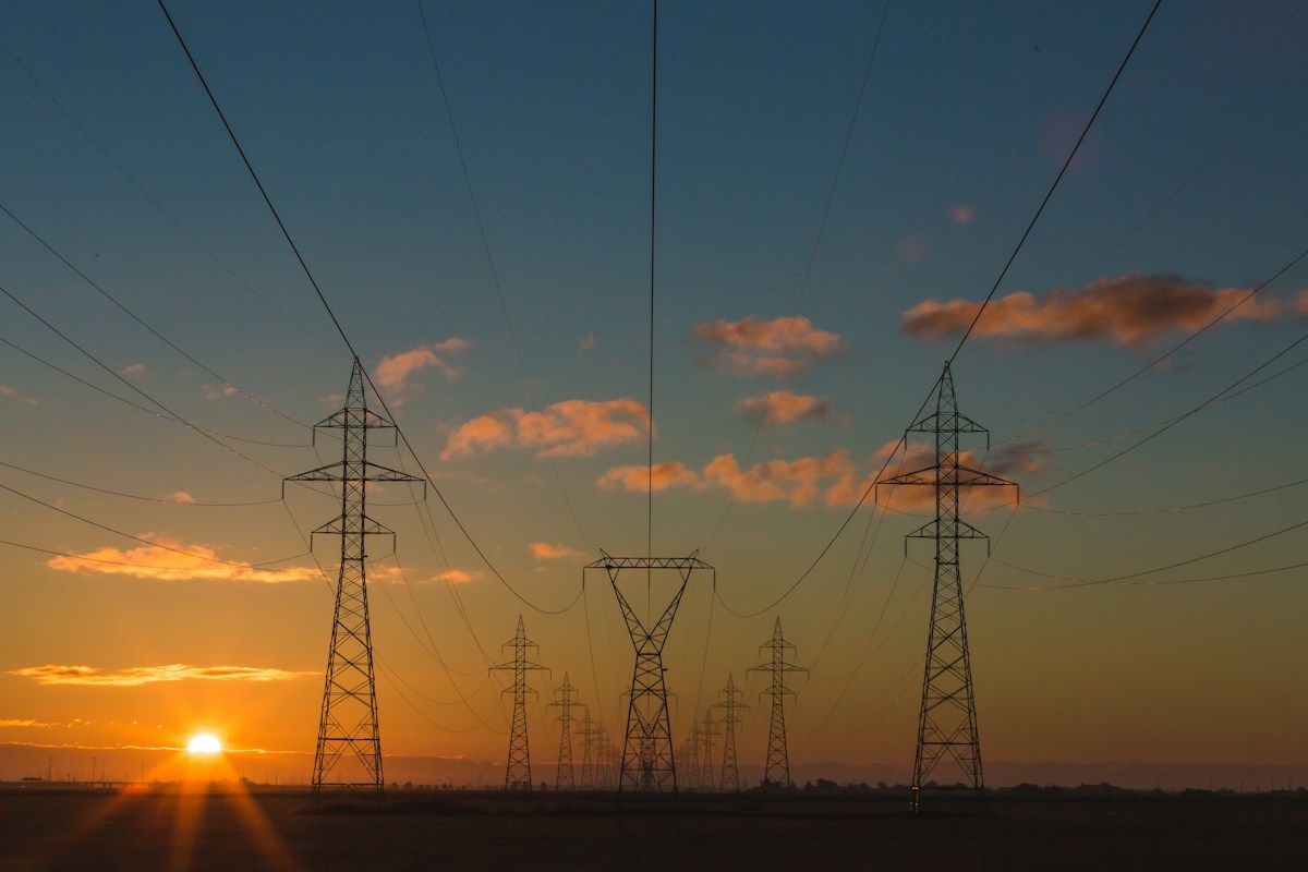 Electricity transmission infrastructure against a dramatic sky